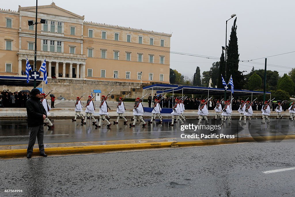 Evzones (Greek Presidential Guard) parade past the Greek...