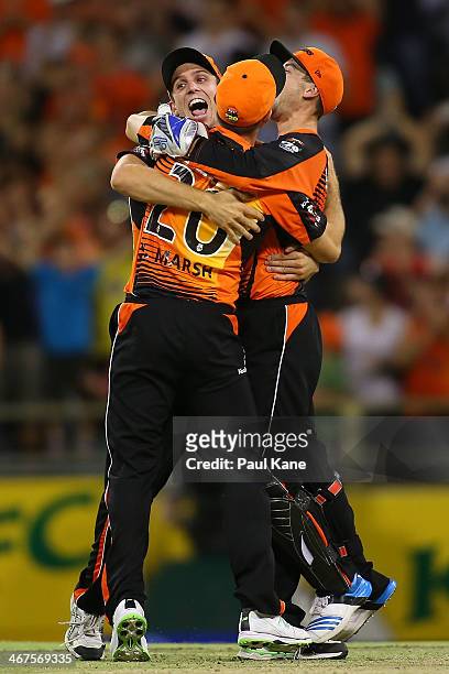 Mitch Marsh, Shaun Marsh and Sam Whiteman of the Scorchers celebrate winning the Big Bash League Final match between the Perth Scorchers and the...