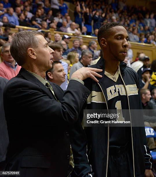 Head coach Jeff Bzdelik gives a pep talk to Madison Jones of the Wake Forest Demon Deacons before their game against the Duke Blue Devils at Cameron...