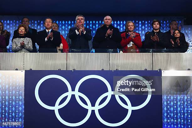 International Olympic Committee President Thomas Bach , Russian President Vladimir Putin and Claudia Bach attend the Opening Ceremony of the Sochi...