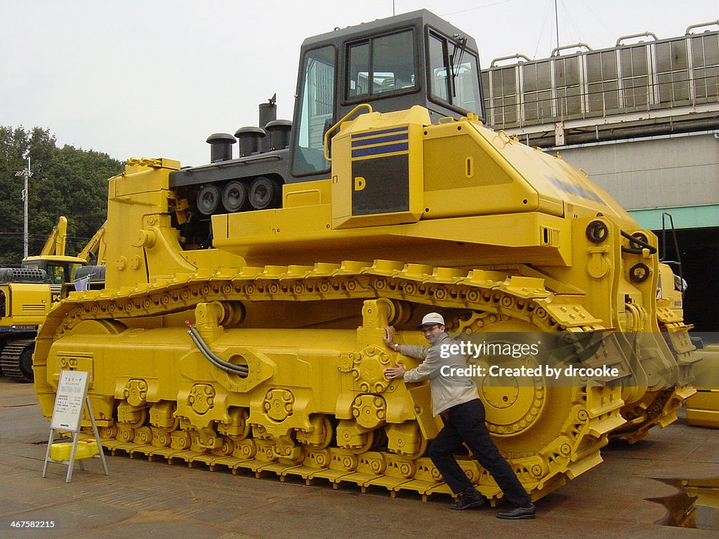 Pushing a big bulldozer