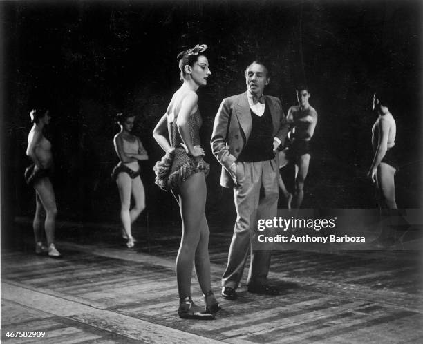 French ballet dancer Tanaquil LeClercq stands with Russian-born American choreographer George Balanchine during a rehearsal, 1950s.