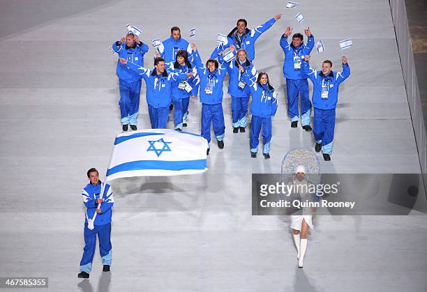 Short track speed skater Vladislav Bykanov of the Israel Olympic team carries his country's flag during the Opening Ceremony of the Sochi 2014 Winter...