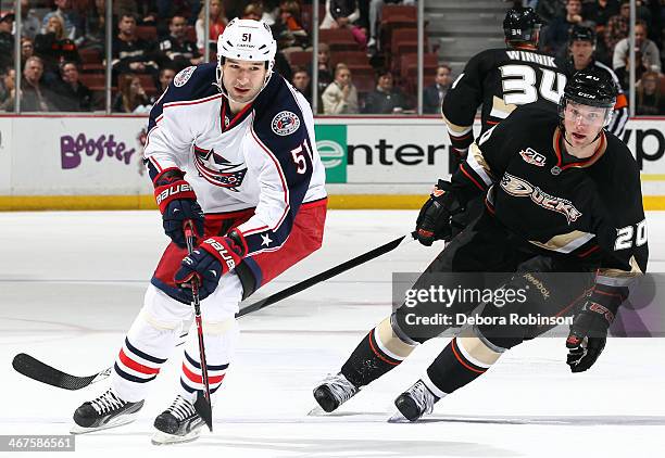Fedor Tyutin of the Columbus Blue Jackets skates against David Steckel of the Anaheim Ducks on February 3, 2014 at Honda Center in Anaheim,...