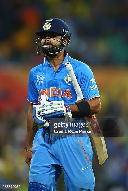 Virat Kohli of India looks dejected after being dismissed by Mitchell Johnson of Australia during the 2015 Cricket World Cup Semi Final match between...