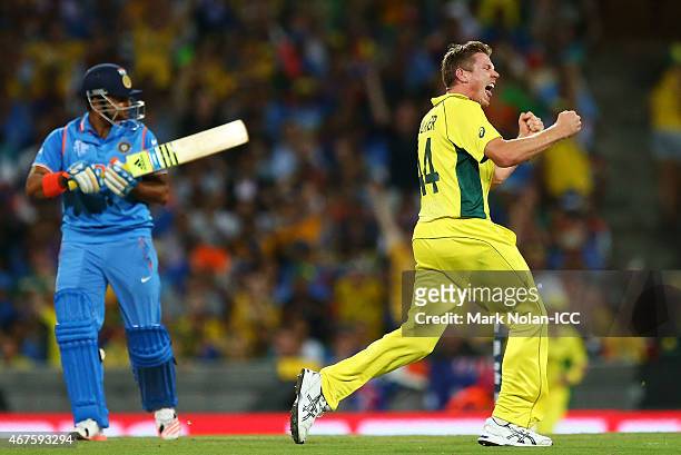 James Faulkner of Australia celebrates getting the wicket of Suresh Raina of India during the 2015 Cricket World Cup Semi Final match between...