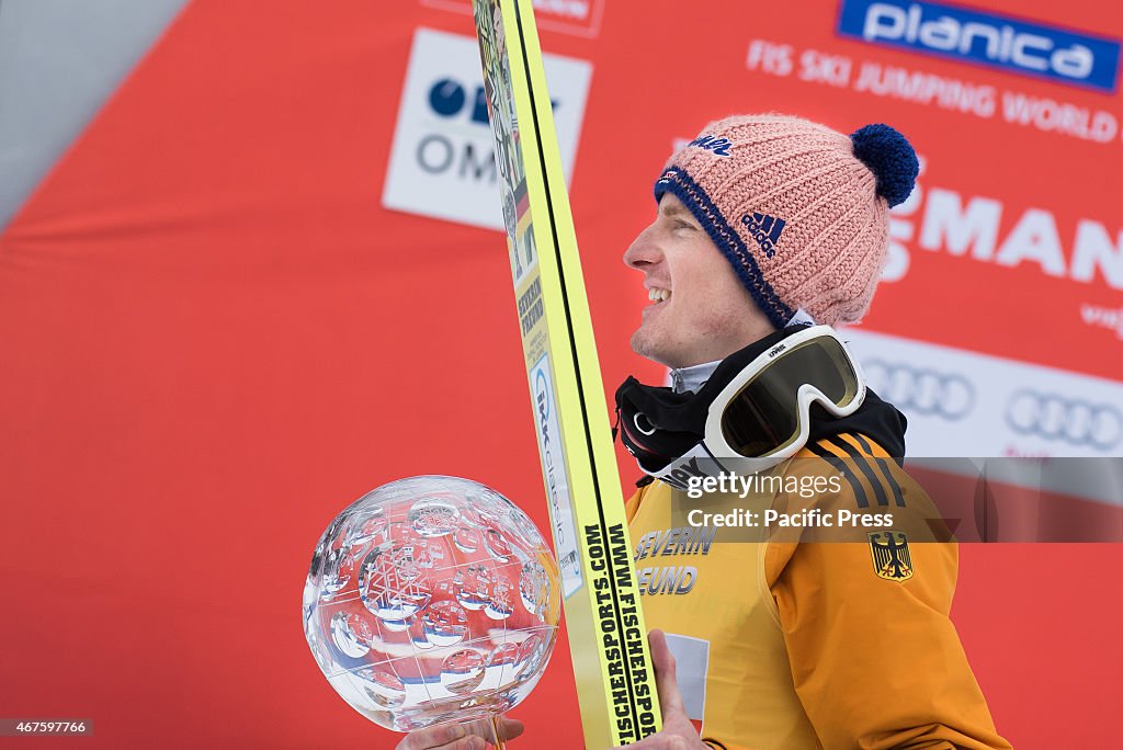 Severin Freund of Germany on the podium with Crystal Globe...