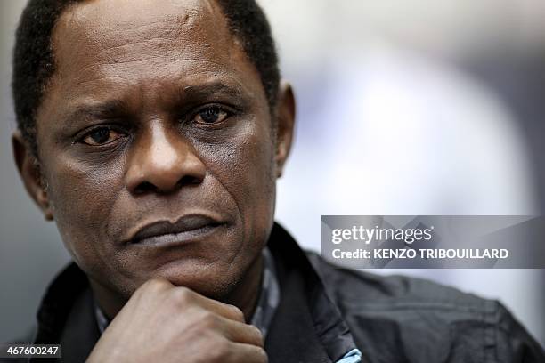 Cameroonian photographer Samuel Fosso poses in Paris on February 7, 2014. "They didn't leave a thing. They even took my bed," explained renowned...