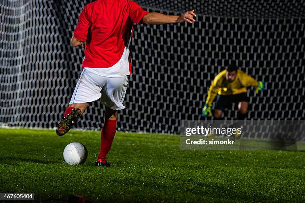 soccer player shooting at goal - penalty kick stock pictures, royalty-free photos & images