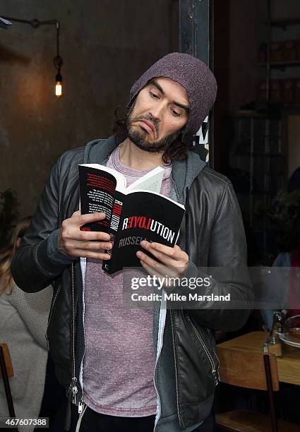 Russell Brand opens the Trew Era Cafe on March 26, 2015 in London, England. The Trew Era Cafe is a social enterprise community project on the New Era...