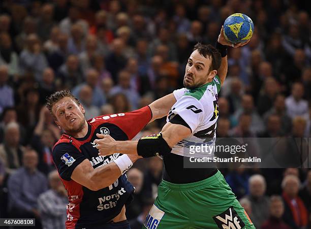 Lars kaufmann of Flensburg is challenged byTim Kneule of Goeppingen during the DKB Bundesliga handball match between SG Flensburg-Handewitt and FA...