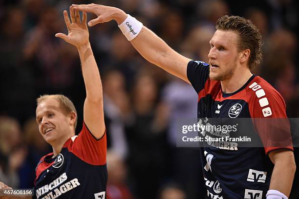 Andres Eggert and Lars Kaufmann of Flensburg celebrate during the DKB Bundesliga handball match between SG Flensburg-Handewitt and FA Goeppingen on...