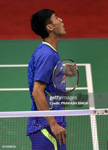 Xue Song of China celebrates a point against Parupalli Kashyap of India during the women's singles badminton match at the Yonex-Sunrise India Open...