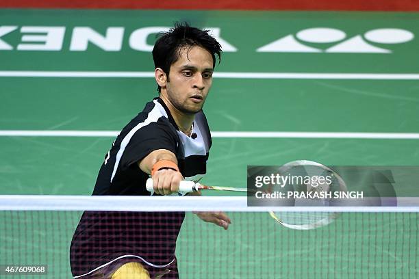 Parupalli Kashyap of India returns a shot to Xue Song of China during the women's singles badminton match at the Yonex-Sunrise India Open 2015 at the...