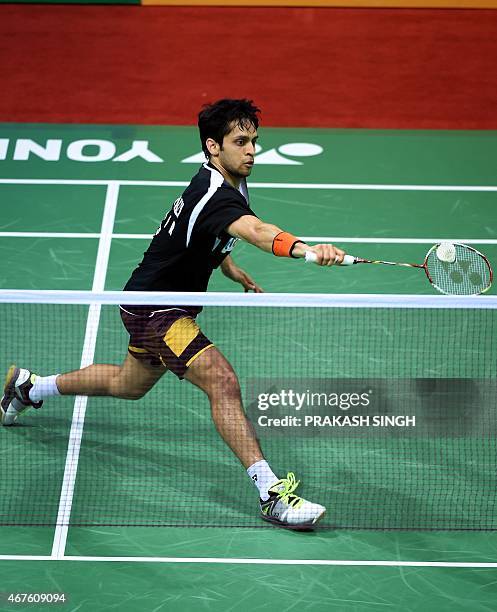 Parupalli Kashyap of India returns a shot to Xue Song of China during the women's singles badminton match at the Yonex-Sunrise India Open 2015 at the...