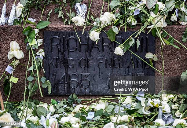 White roses adorn the statue of Richard III outside Leicester Cathedral before the reinterment ceremony of King Richard III, on March 26, 2015 in...