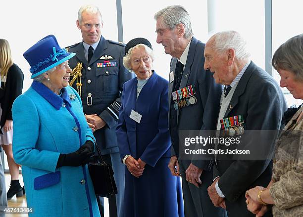 Queen Elizabeth II meets Mrs K Foster , Wing Commander Paul Farnes and Squadron Leader Tom Pickering as she visits the National Memorial to the Few...