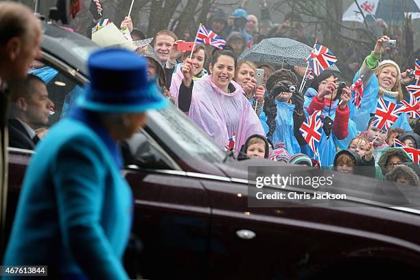 Schoolchildren wave to Queen Elizabeth II as she visits the National Memorial to the Few after opening a new wing on March 26, 2015 in Folkestone,...