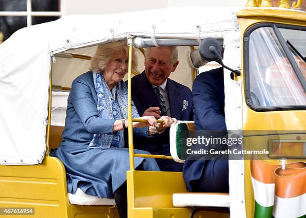 Camilla, Duchess of Cornwall and Prince Charles, Prince of Wales ride in a rickshaw at Clarence House on March 26, 2015 in London, England. In...