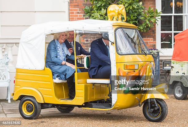 Prince Charles, Prince of Wales and Camilla, Duchess of Cornwall ride in a rickshaw as they launch 'Travels to my Elephant' Rickshaw Race at Clarence...