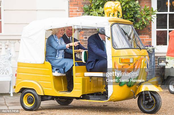 Prince Charles, Prince of Wales and Camilla, Duchess of Cornwall ride in a rickshaw as they launch 'Travels to my Elephant' Rickshaw Race at Clarence...