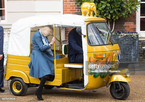 Camilla, Duchess of Cornwall rides in a rickshaw as they launch 'Travels to my Elephant' Rickshaw Race at Clarence House on March 26, 2015 in London,...
