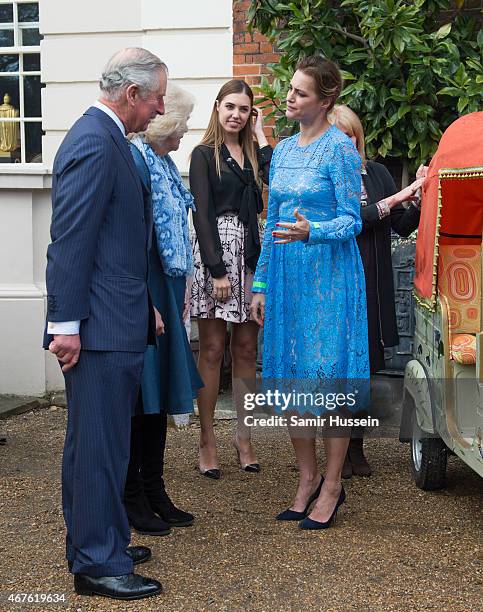 Prince Charles, Prince of Wales and Camilla, Duchess of Cornwall talks to Yasmin Le Bon and Amber Le Bon at the launch of 'Travels to my Elephant'...
