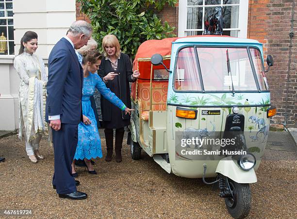 Prince Charles, Prince of Wales talks to Yasmin Le Bon and Joanna Lumley at the launch of 'Travels to my Elephant' Rickshaw Race at Clarence House on...