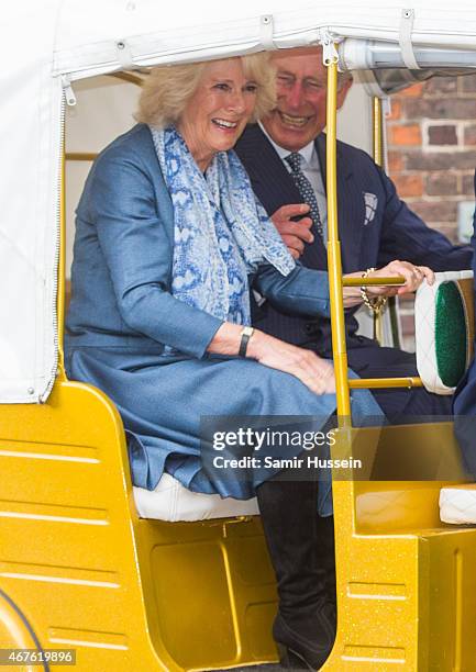 Prince Charles, Prince of Wales and Camilla, Duchess of Cornwall ride in a rickshaw as they launch 'Travels to my Elephant' Rickshaw Race at Clarence...