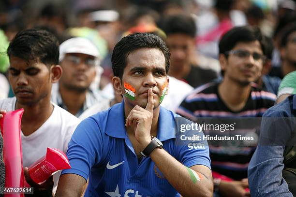 Disappointed fans after the Indian Cricket team lost the Cricket world cup semifinal match against Australia, at Select City Walk mall on March 26,...