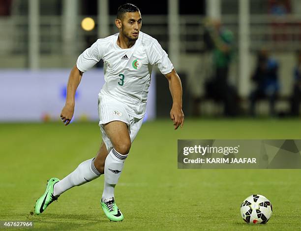 Algeria's Faouzi Ghoulam controls the ball during the friendly football match between Qatar and Algeria at Abdullah bin Nasser bin Khalifa Stadium in...