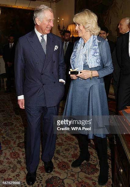 Prince Charles, Prince of Wales and Camilla, Duchess of Cornwall attend a reception to launch 'Travels To My Elephant' at Clarence House on March 26,...
