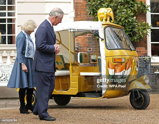 Prince Charles, Prince of Wales and Camilla, Duchess of Cornwall take a ride in a tuk tuk to launch 'Travels To My Elephant' at Clarence House on...