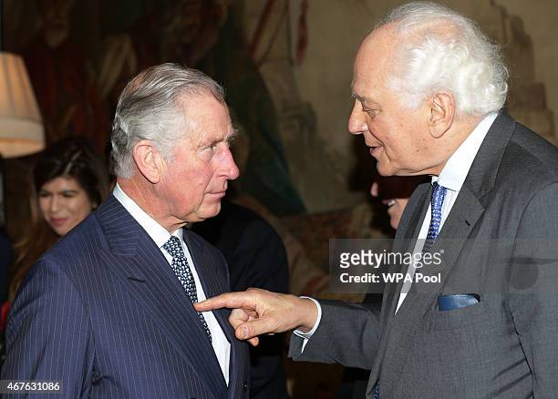 Prince Charles, Prince of Wales speaks with with Sir Evelyn de Rothschild during a reception to launch 'Travels To My Elephant' at Clarence House on...
