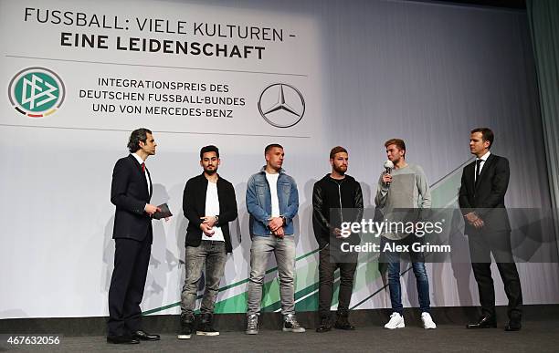 Presenter Ali Aslan, Ilkay Guendogan, Lukas Podolski, Shkodran Mustafi, Christoph Kramer and Oliver Bierhoff attend the DFB & Mercedes Benz...