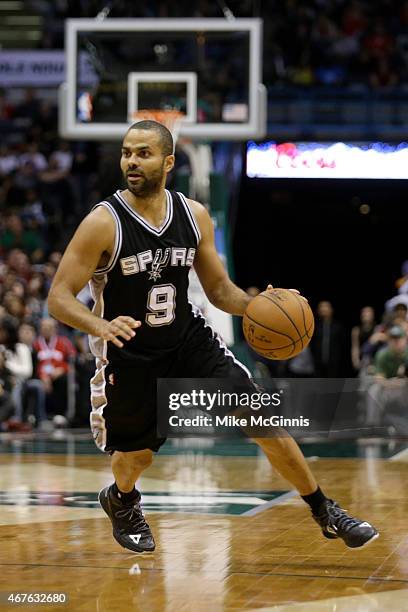 Tony Parker of the San Antonio Spurs dribbles the basketball up the court during the game against the Milwaukee Bucks at BMO Harris Bradley Center on...