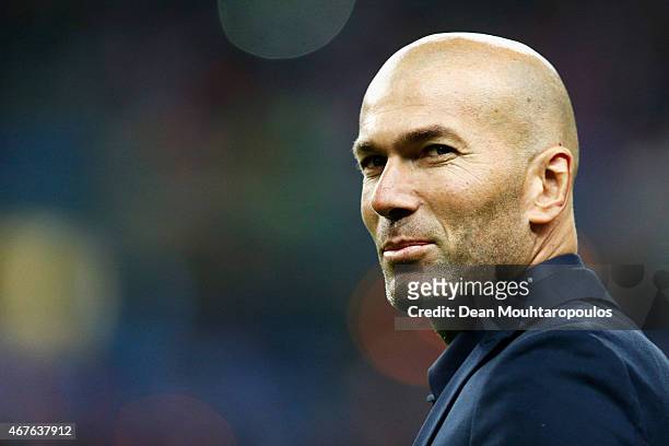 Former French international, Zinedine Zidane walks on the field prior to the International Friendly match between France and Brazil at the Stade de...