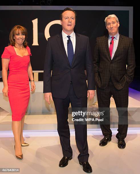 Kay Burley of Sky News, British Prime Minister David Cameron and Jeremy Paxman of Channel 4 pose ahead of the filming of 'Cameron & Miliband ; The...