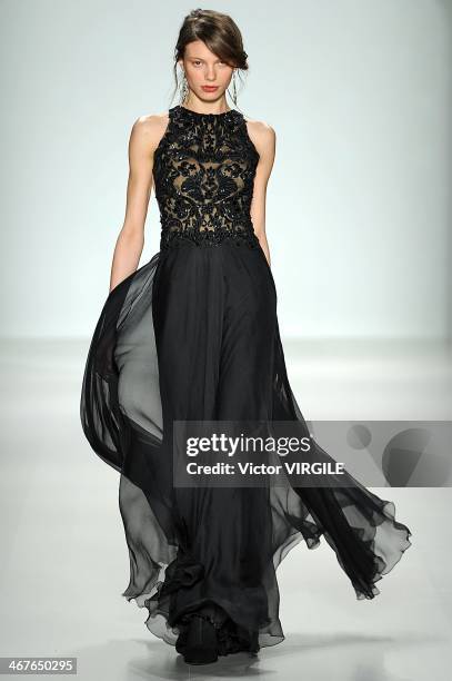 Model walks the runway at Tadashi Shoji Ready to Wear Fall/Winter 2014-2015 fashion show during Mercedes-Benz Fashion Week Fall 2014 at The Salon at...