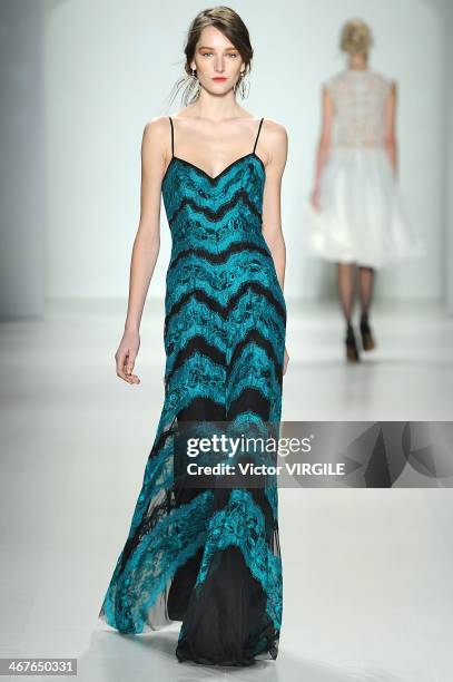 Model walks the runway at Tadashi Shoji Ready to Wear Fall/Winter 2014-2015 fashion show during Mercedes-Benz Fashion Week Fall 2014 at The Salon at...