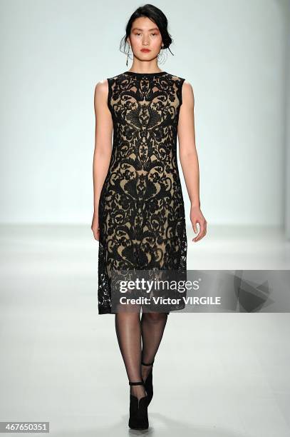 Model walks the runway at Tadashi Shoji Ready to Wear Fall/Winter 2014-2015 fashion show during Mercedes-Benz Fashion Week Fall 2014 at The Salon at...