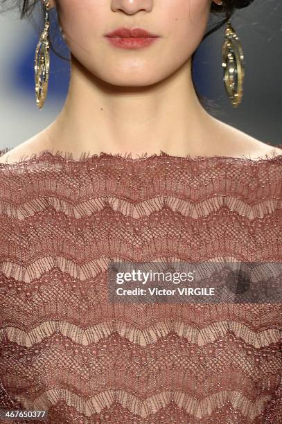 Model walks the runway at Tadashi Shoji Ready to Wear Fall/Winter 2014-2015 fashion show during Mercedes-Benz Fashion Week Fall 2014 at The Salon at...