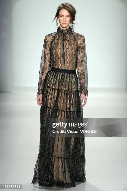 Model walks the runway at Tadashi Shoji Ready to Wear Fall/Winter 2014-2015 fashion show during Mercedes-Benz Fashion Week Fall 2014 at The Salon at...