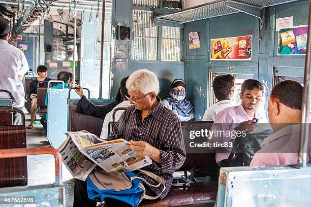 people travelling on local mumbai train - mumbai train stock pictures, royalty-free photos & images