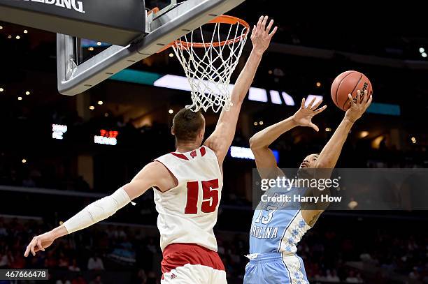 Tokoto of the North Carolina Tar Heels goes up for a shot against Sam Dekker of the Wisconsin Badgers in the first half during the West Regional...