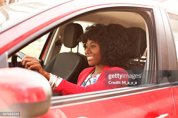 woman driver - red car stock pictures, royalty-free photos & images