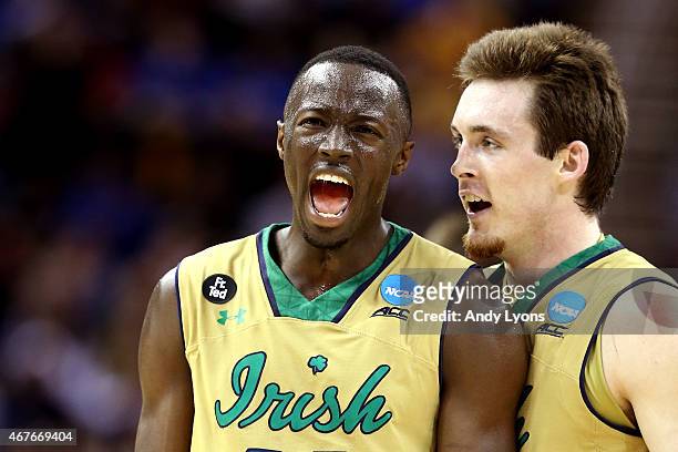 Jerian Grant of the Notre Dame Fighting Irish celebrates with Pat Connaughton after a play in the second half against the Wichita State Shockers...