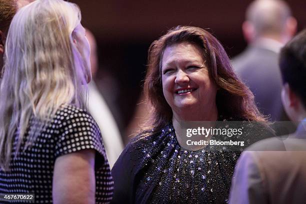 Billionaire Gina Rinehart, chairman of Hancock Prospecting Pty, center, speaks with attendees during the Mines and Money conference in Hong Kong,...