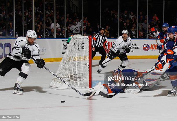 Jaroslav Halak of the New York Islanders makes the save as Marian Gaborik of the Los Angeles Kings looks for the rebound during the third period at...