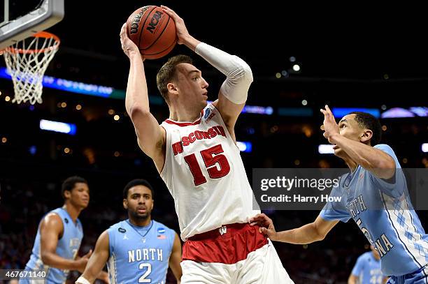 Sam Dekker of the Wisconsin Badgers with the ball against Marcus Paige of the North Carolina Tar Heels in the second half during the West Regional...